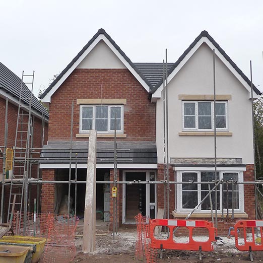 new build house surrounded by scaffold