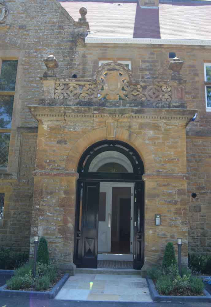 arched doorway to a manor house