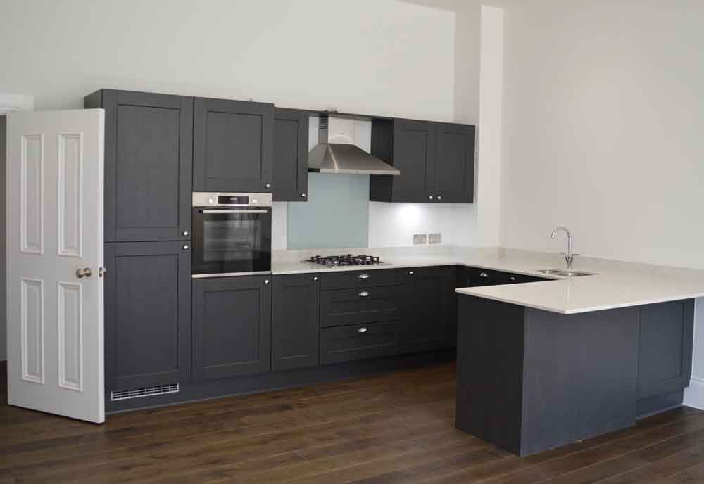 modern grey kitchen with white worktops