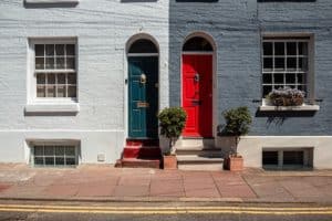 British townhouse with a blue door and red front door