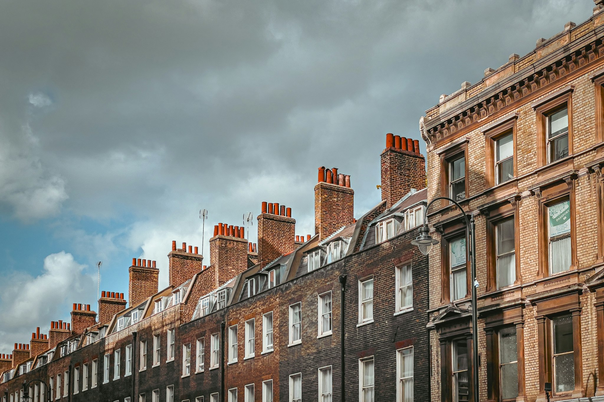 Row of red brick buildings in a city centre