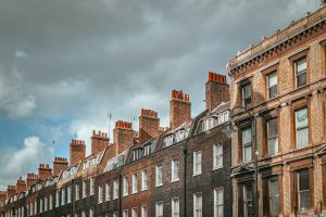 Row of red brick buildings in a city centre